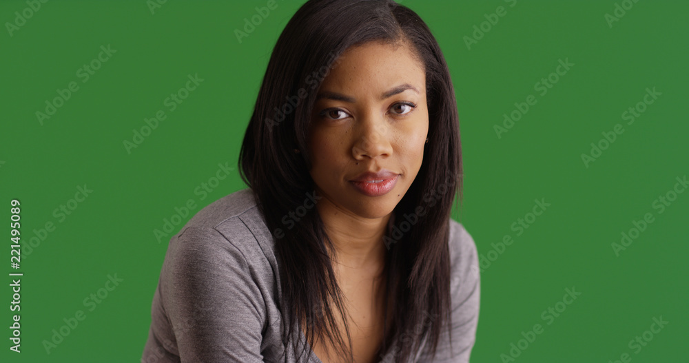 Portrait of beautiful black female with straight hair on green screen Portrait of beautiful black female with straight hair on green screen