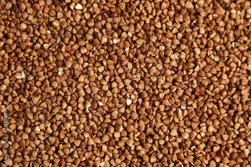 Buckwheat grains. Dry brown kernel as background Buckwheat grains. Dry brown kernel as background