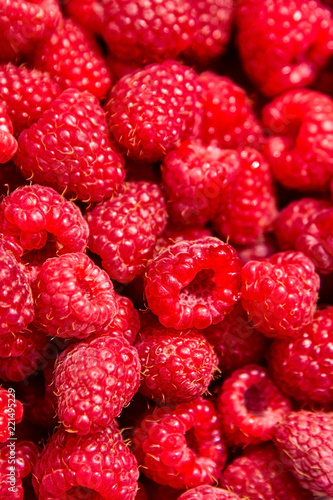 Fresh red ripe raspberries as background, closeup