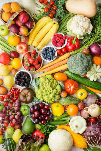 Healthy fruits vegetables berries background  cherries peaches strawberries cabbage broccoli cauliflower squash tomatoes carrots bananas beans beetroot  pepper  top view  vertical  selective focus