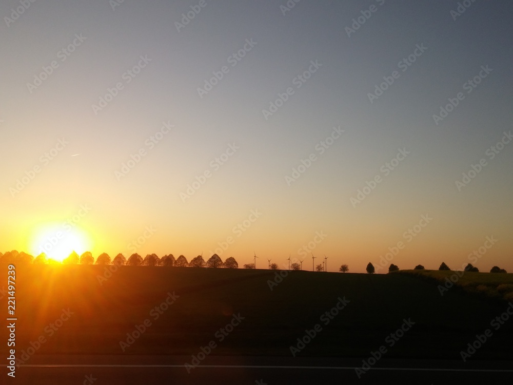 Minimalist sunset view, clear sky, panoramic horizon with trees, gradient colorful sky with copy space for banner, lyrics, blog post, social media, youtube, instagram, blog post
