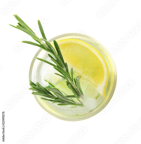 Glass of refreshing lemon cocktail with rosemary on white background, top view