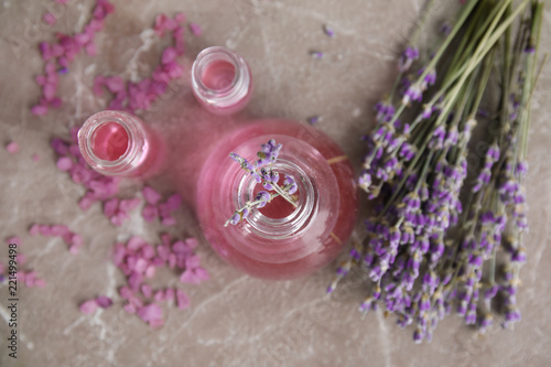 Fototapeta Naklejka Na Ścianę i Meble -  Flat lay composition with aromatic lavender oil on grey background