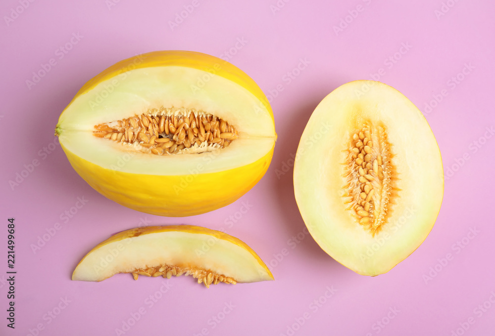 Flat lay composition with cut melon on color background
