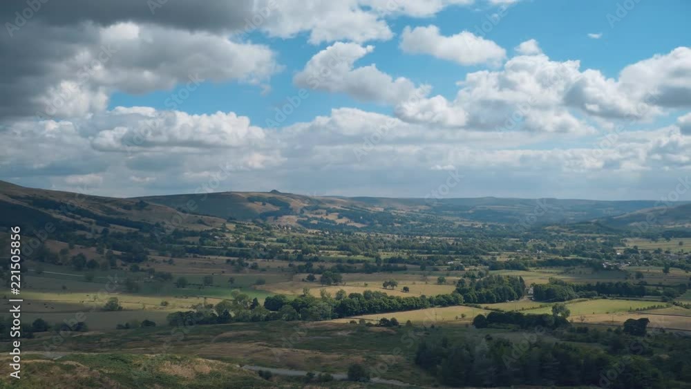 Time lapse. Moving fluffy clouds over the farmlands and hills. England. Time lapse. Moving fluffy clouds over the farmlands and hills. England.