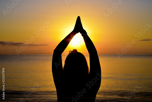 Yoga poses a tree in the sea photo