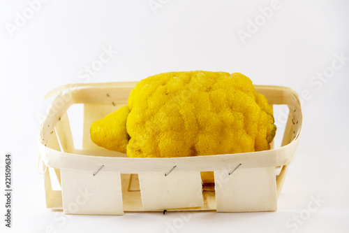 lemon in basket on white background