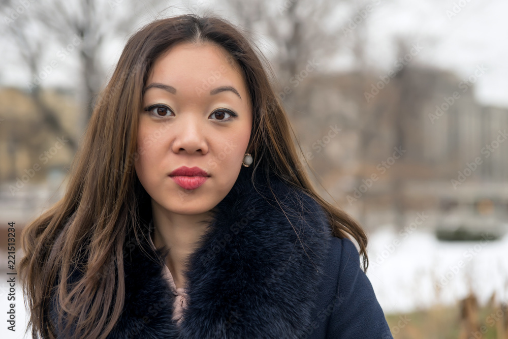 Naklejka premium frontal portrait of a beautiful Asian girl