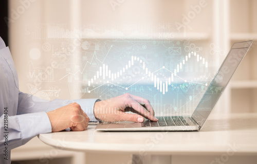 Canvas Print Business woman in homey environment using laptop with global financial report co