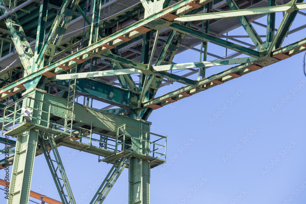 Halifax, closeup, bridge, steel, girders, metal, green, blue sky.