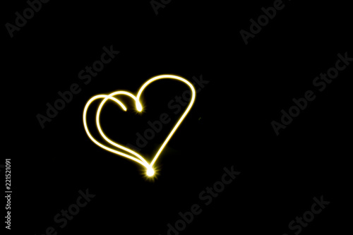 Heart line symbol created by light  black background