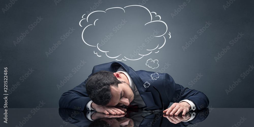 Young businessman sleeping and dreaming at the office
Young businessman sleeping and dreaming at the office