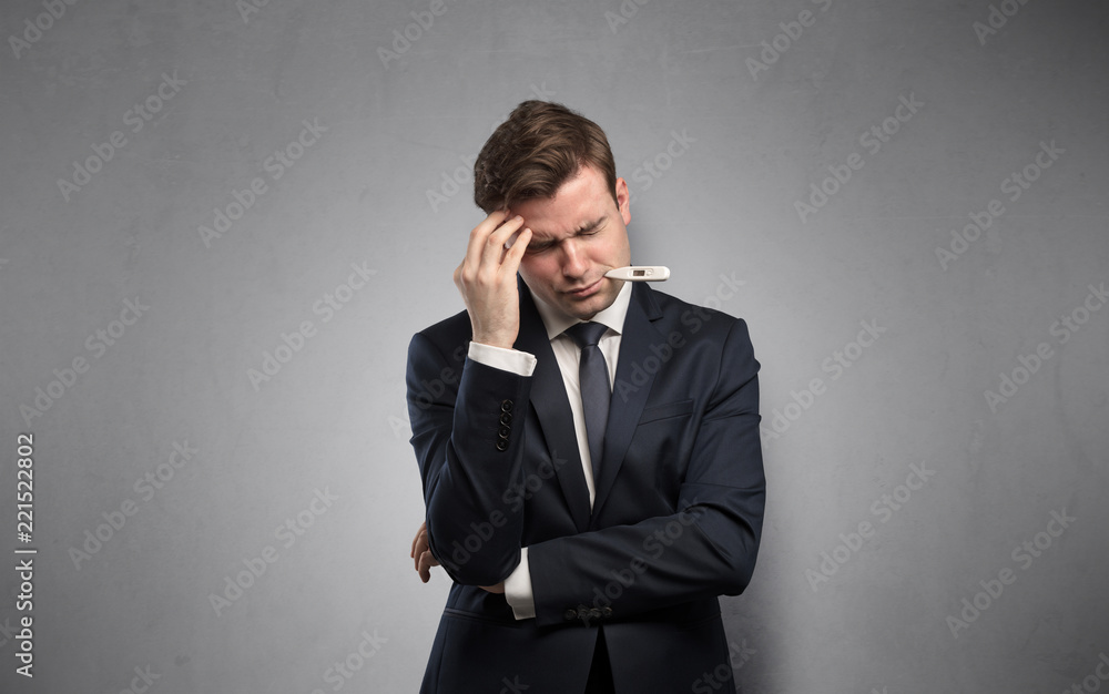 Young tired businessman with thermometer and copy space
Young tired businessman with thermometer and copy space