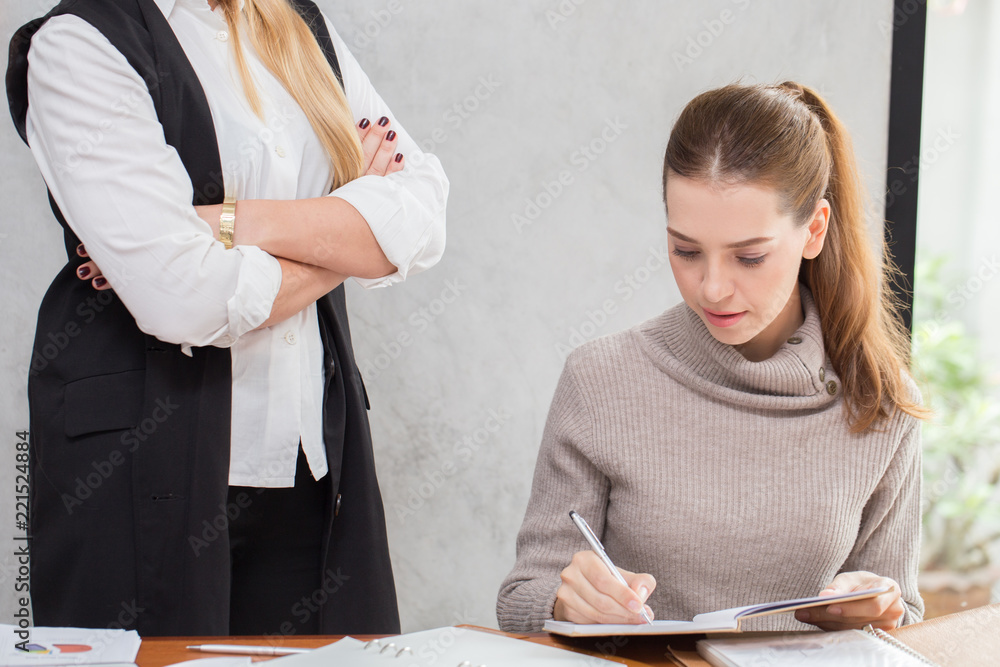 Manager scold Caucasian woman officer and writing report to get requirement and ideas with business strategy plan Manager scold Caucasian woman officer and writing report to get requirement and ideas with business strategy plan