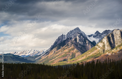 Dramatic Cloudscape Sky and Distant Snowcapped Mountain Peaks Canadian Rockies photo