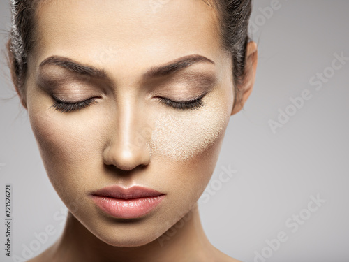 dry cosmetic makeup powder is on the female face.