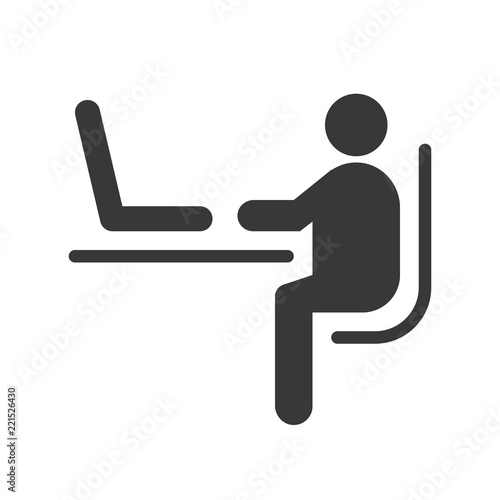 human sitting on chair and using laptop on table