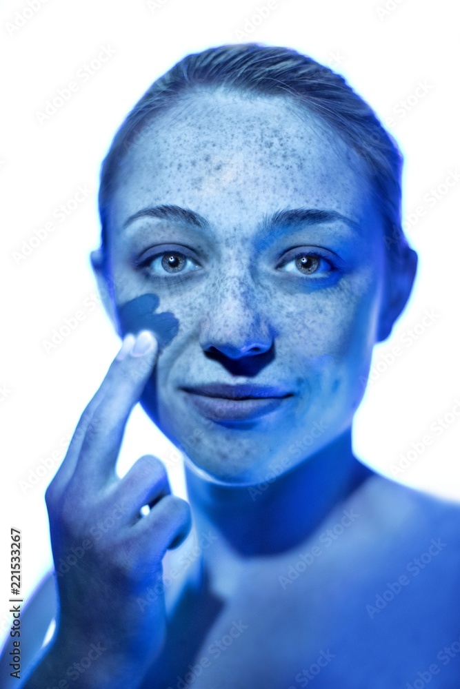 Woman applying sunscreen Woman applying sunscreen