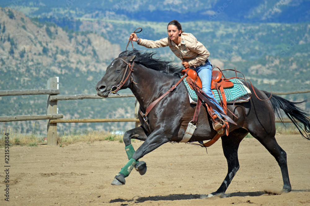 Cowgirl Looks at Stop Clock While Galloping Cowgirl Looks at Stop Clock While Galloping