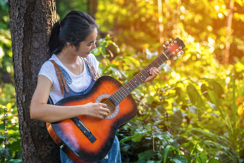 Women playing guitar wild