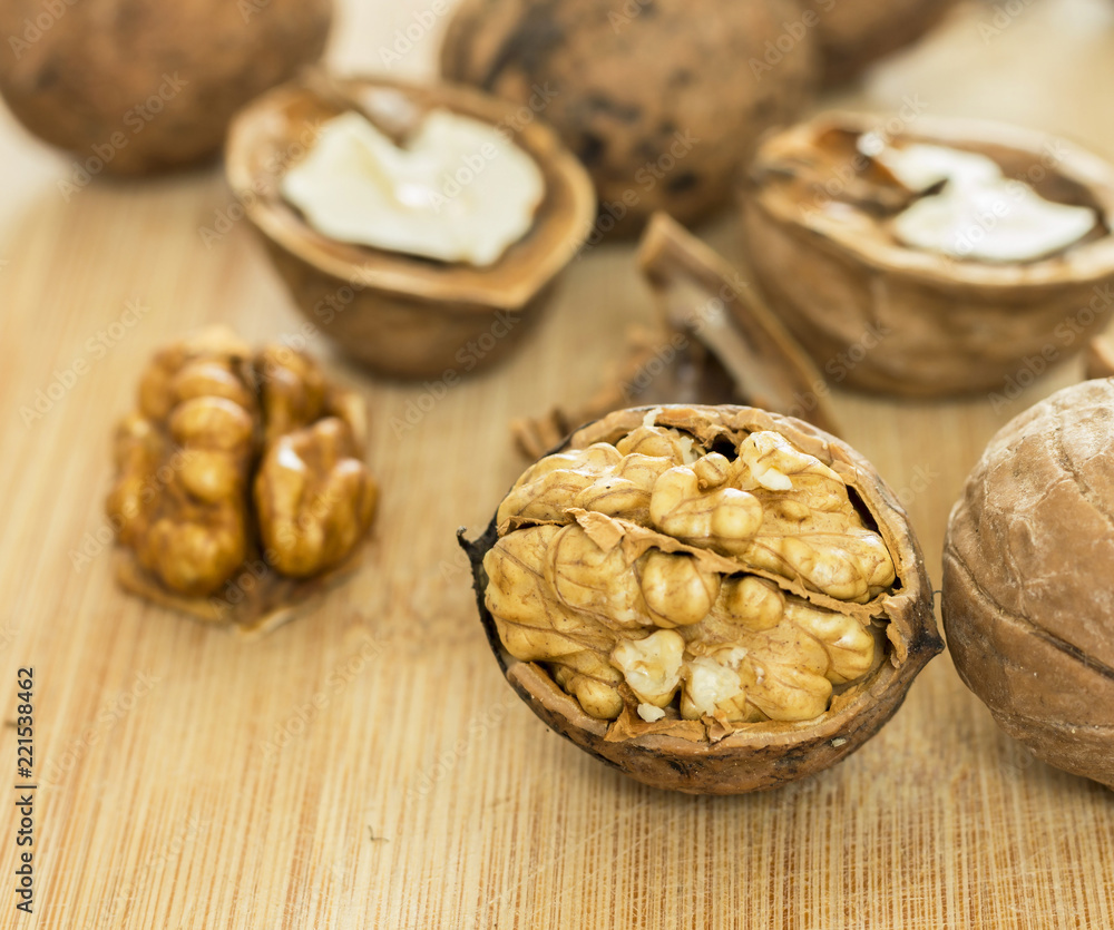 Healthy food safety concept:Walnuts kernels on dark desk with color background Healthy food safety concept:Walnuts kernels on dark desk with color background