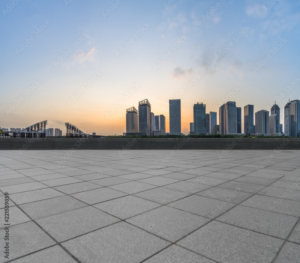 Panoramic skyline and buildings with empty square floor.