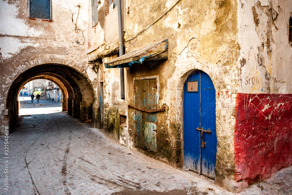 In the former Jewish quarter of Mellah in Essaouira, Morocco, the doors of dilapidated buildings are condemned