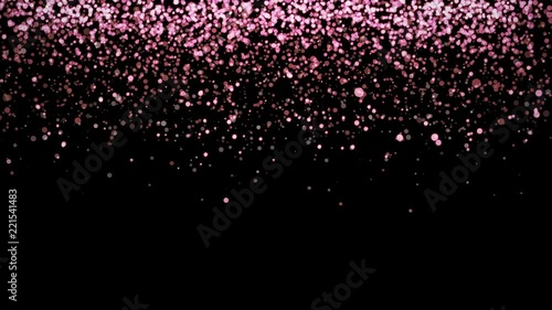 Rose gold glitter partikles texture falling down on black background.