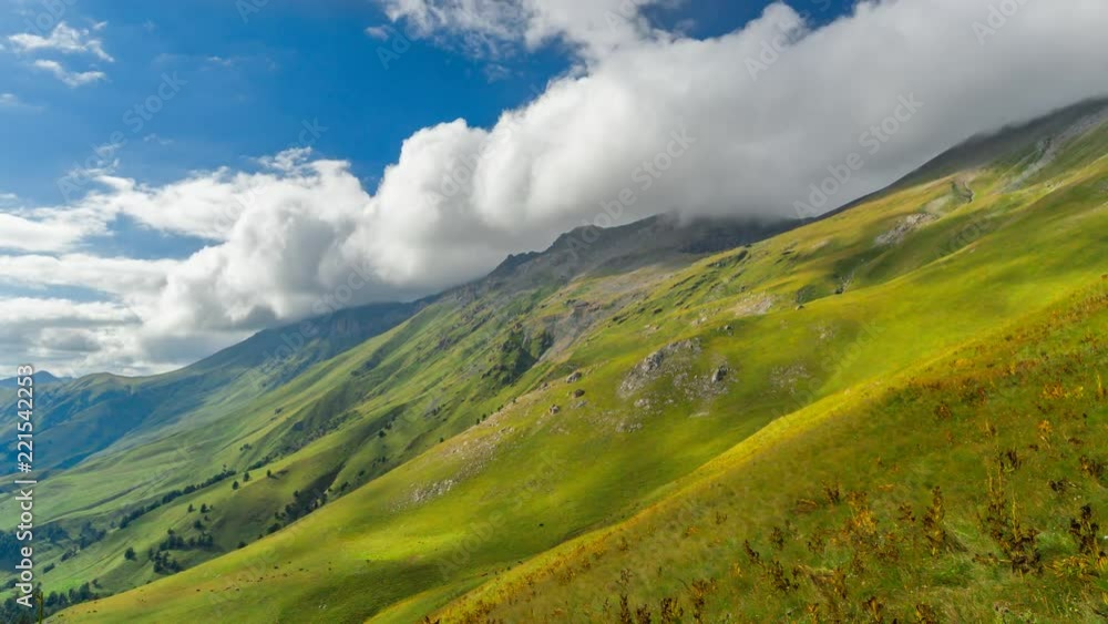 Time lapse of cloudscape with clouds passing blue sky over the mountain of Arkhyz with green grass. Time lapse of cloudscape with clouds passing blue sky over the mountain of Arkhyz with green grass.