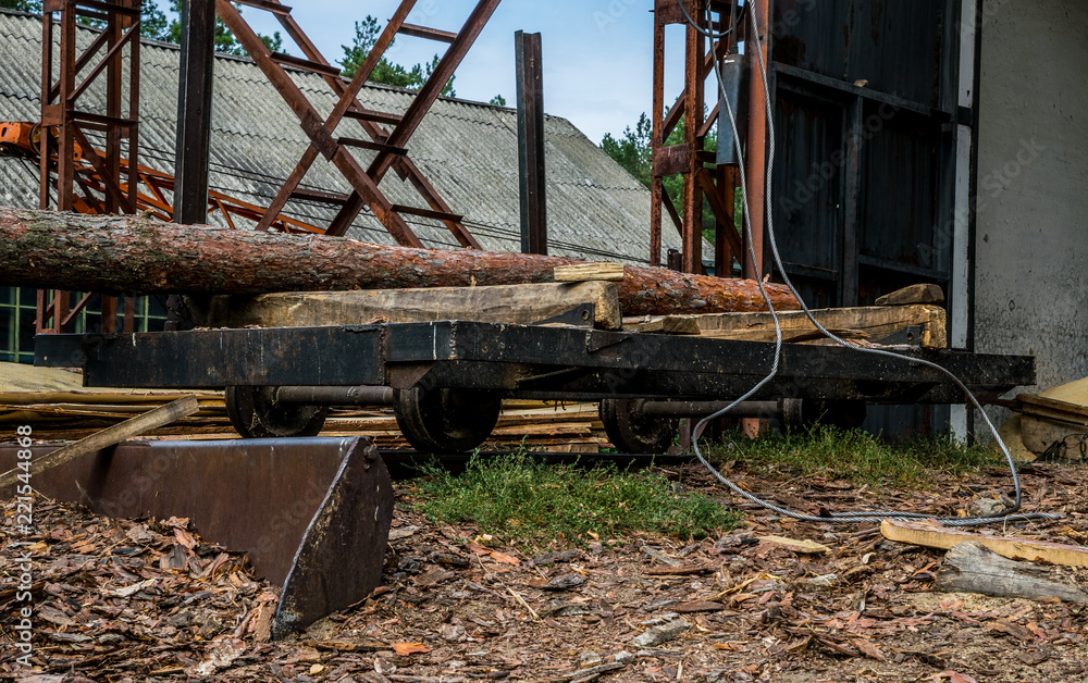 Fototapeta premium Old sawmill in Colorado. Pine wood and sawn wood