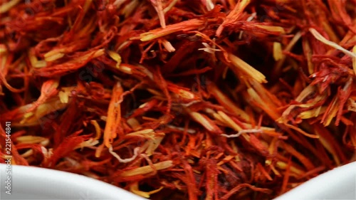 Chinese herb medicine of Carthami Flos or Safflower rotating close up photo