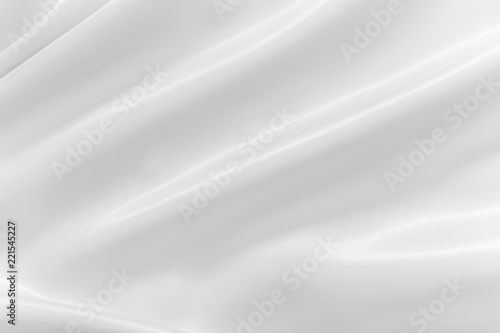 Smooth elegant shiny silver silk or satin luxury cloth texture can use as abstract holidays background. Luxurious Christmas background or New Year background design.
