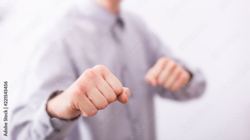Αυτοκόλλητο Male hands are showing clenched fists for business fight.