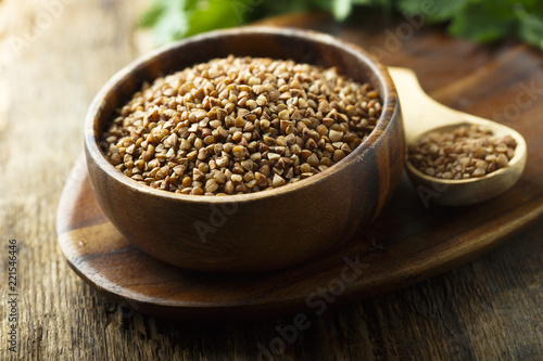 Raw buckwheat in the wooden bowl © marysckin