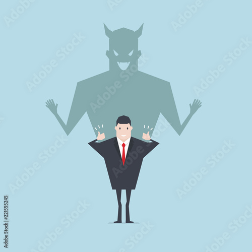 Devil shadow behind a smiling face of businessman.