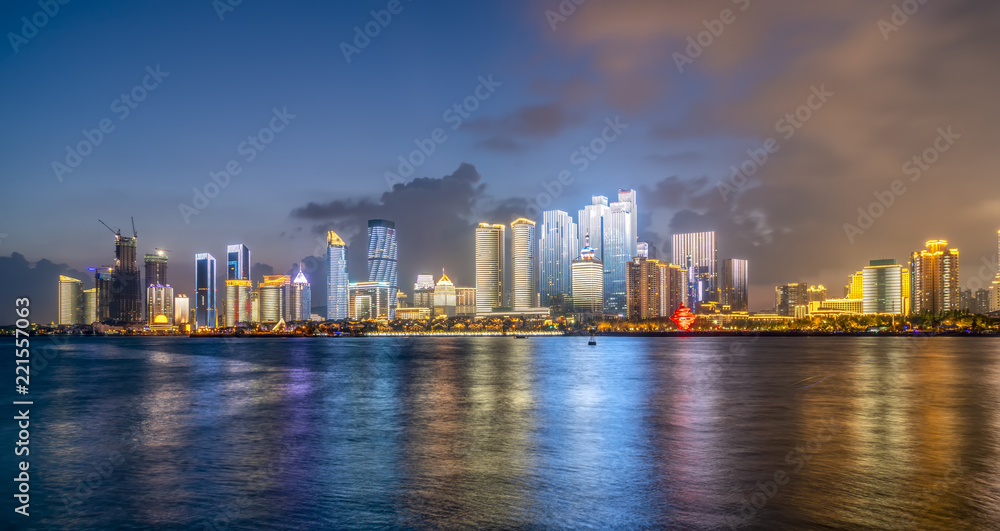 Fototapeta premium Night view of modern urban architecture landscape in Qingdao..