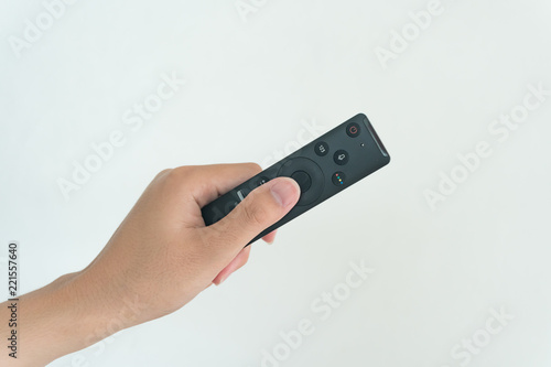 Hand holding Remote TV on white background