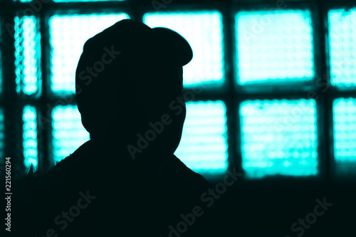 silhouette of man in jail