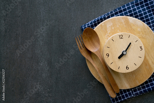 Food clock. Healthy food concept on black table background