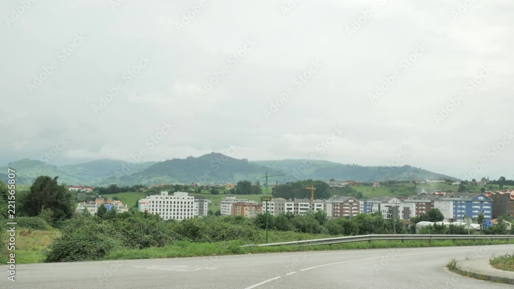 The hilly countryside view with green plants and cloudy sky The hilly countryside view with green plants and cloudy sky