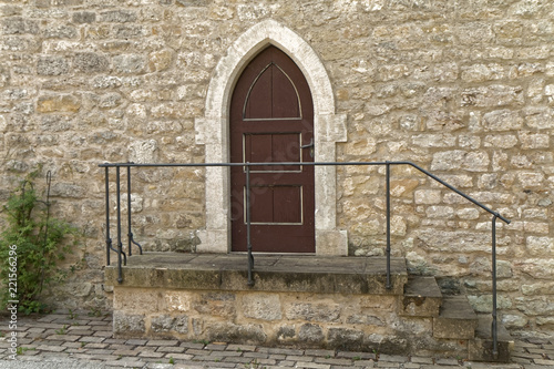 Old, wooden door with stone stairs. © MiroslawKopec