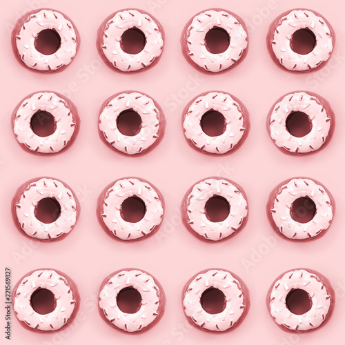 Many small plastic donuts lies on a pastel colorful background. Flat lay minimal pattern. Top view photo