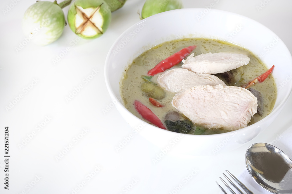 Green curry soup with top view on white table and copy space.