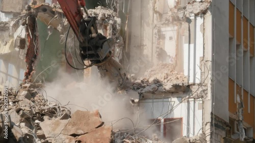 demolition of the building, demolition work, excavator at work photo