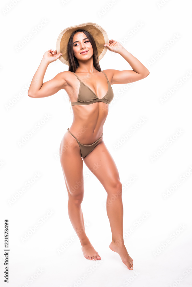 Young beautiful fitness woman in bikini and straw hat isolated on white background Young beautiful fitness woman in bikini and straw hat isolated on white background