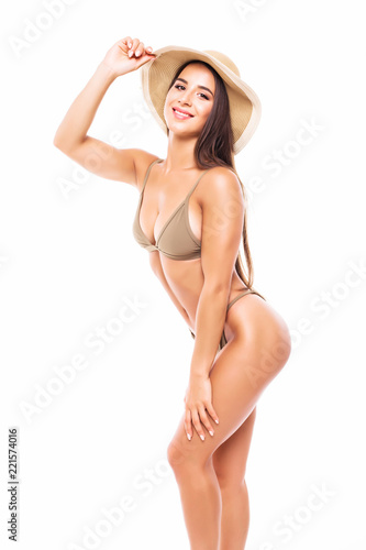 Portrait of sexy beautiful brunette woman in swimsuit in straw hat on white background