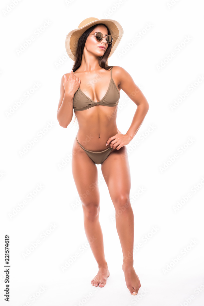 Full bodyPretty girl posing in bikini summer hat and sunglasses isolated on white background Full bodyPretty girl posing in bikini summer hat and sunglasses isolated on white background