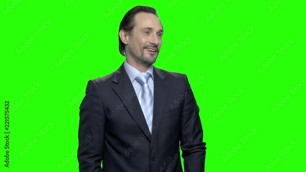 Portrait of mature businessman flirting with someone. Handsome confident middle aged macho in business suit seduces someone. Green hromakey background for keying. Portrait of mature businessman flirting with someone. Handsome confident middle aged macho in business suit seduces someone. Green hromakey background for keying.
