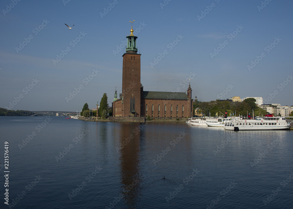 City Hall of Stockholm and boats by Riddarfjärden in Stockholm