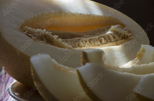 Cut fresh melon with slices close-up on the table